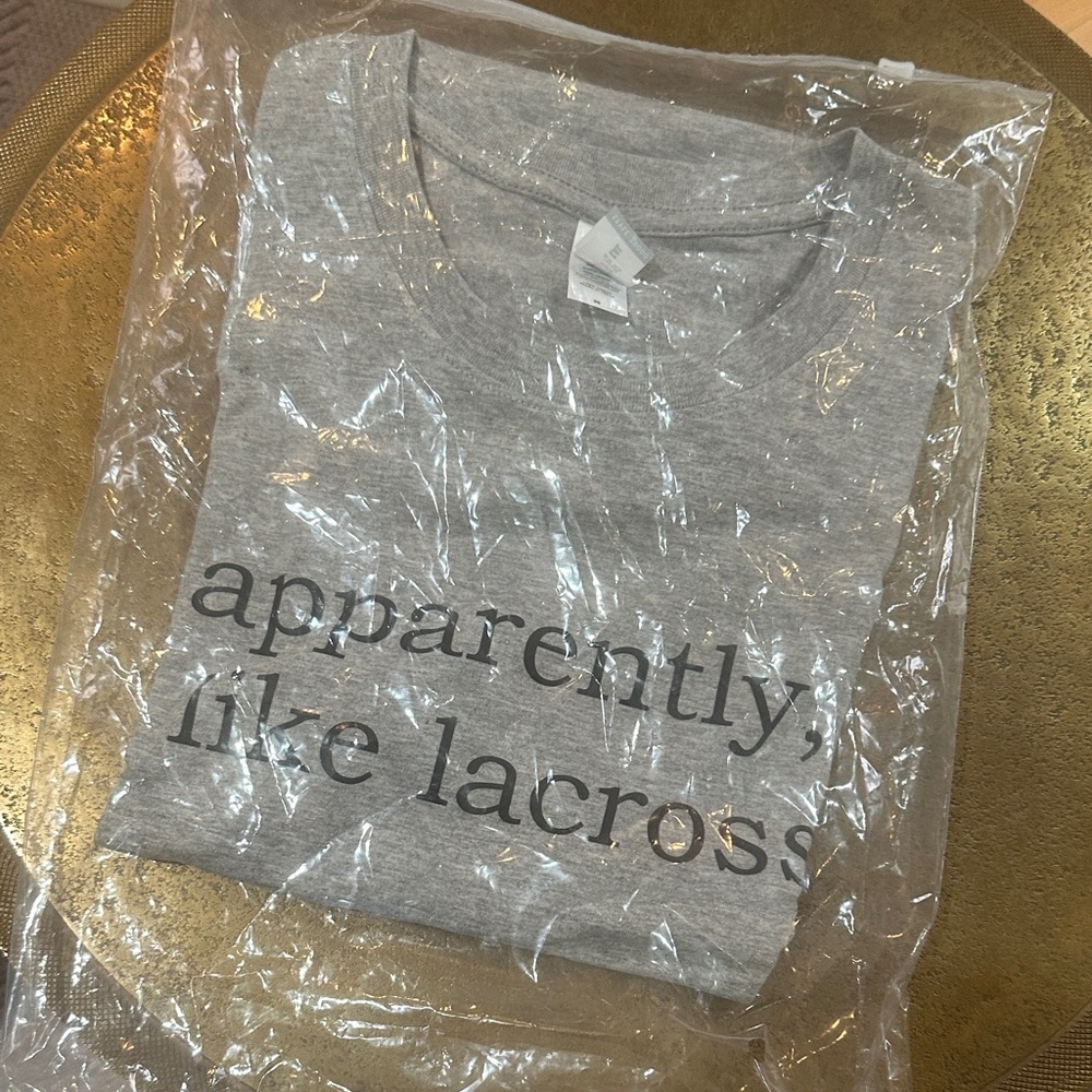Gray Graphic women’s Tee with Lacrosse Print. Brand new in package. Size M